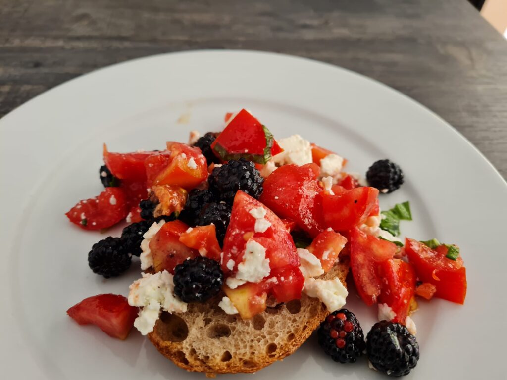 Olive oil, feta, tomato & blackberry toast